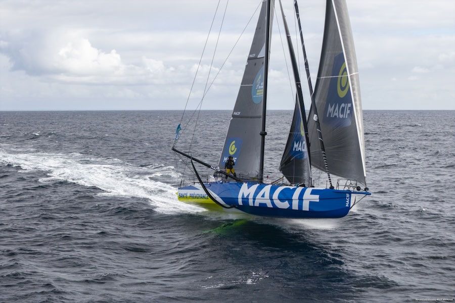 Sam Goodchild at the helm of MACIF Santé Prévoyance, leading the IMOCA fleet offshore.