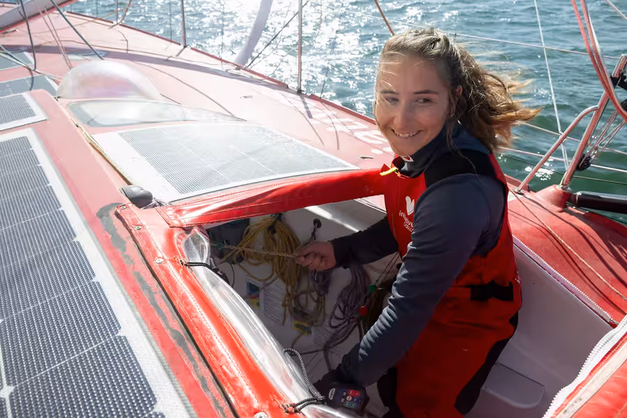 Violette Dorange at the helm of her IMOCA Initiatives Coeur.