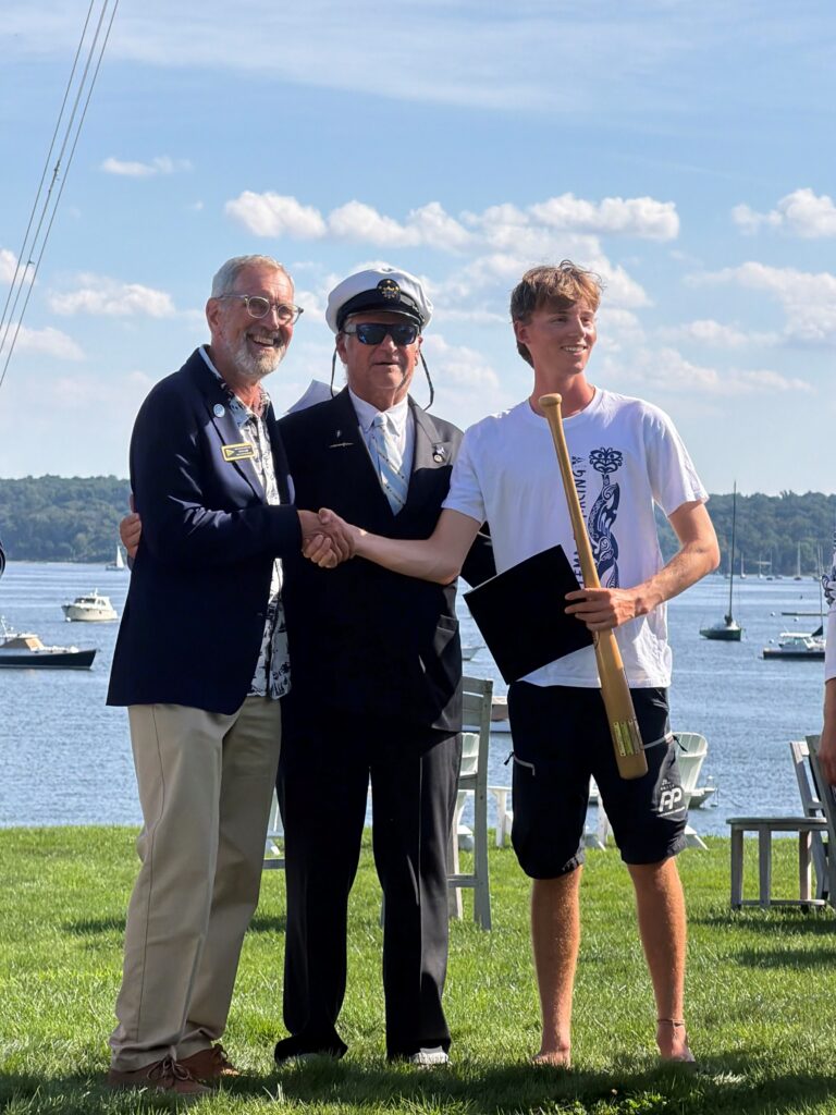 From left, Tom Camp (Congressional Cup 2027 Chair), Julian Fisher II (Commodore, Seawanhaka Corinthian Yacht Club) and Josh Hyde, winner of the 2026 Grand Slam.