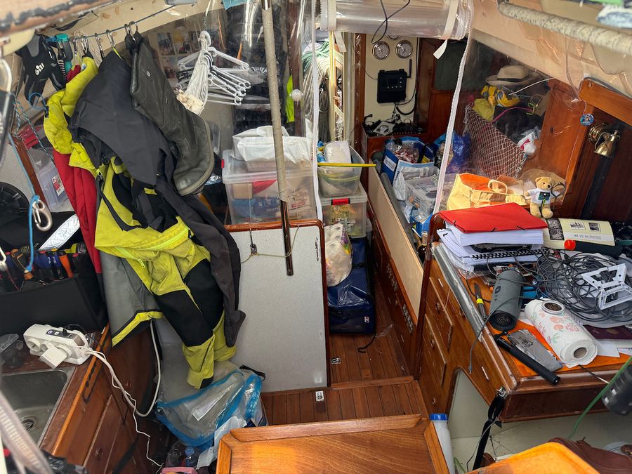 Hours before the GGR2026 start, Louis Kerdelhué's Biscay 36 IE Charge remains cluttered with gear and clothing as last-minute preparations continue.