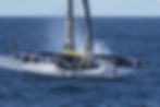 The Ultim Maxi Edmond de Rothschild, Gitana 18, cutting through the water in fine form.