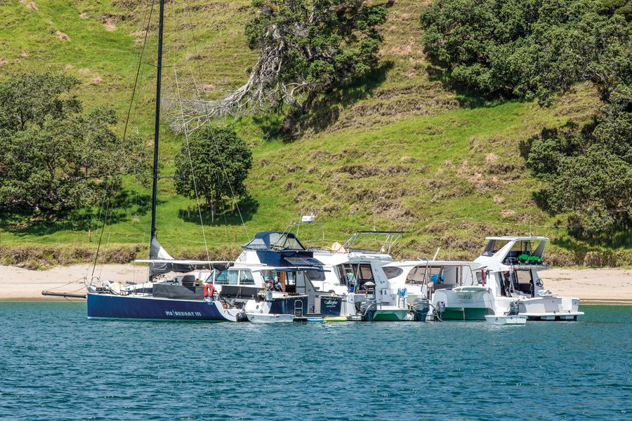 Raft up at Mimiwhangata Bay. In 'Slow boat to Racehorse River'. // Photo by: Lesley Stone / Alex Stone