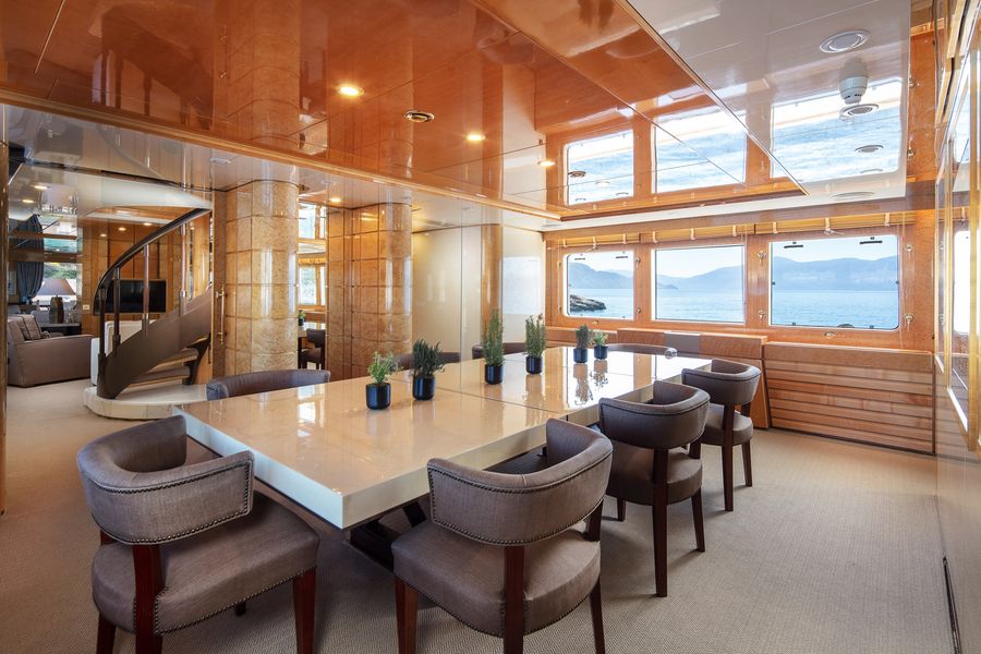 Dining room connected to a large saloon, with a very dramatic staircase.