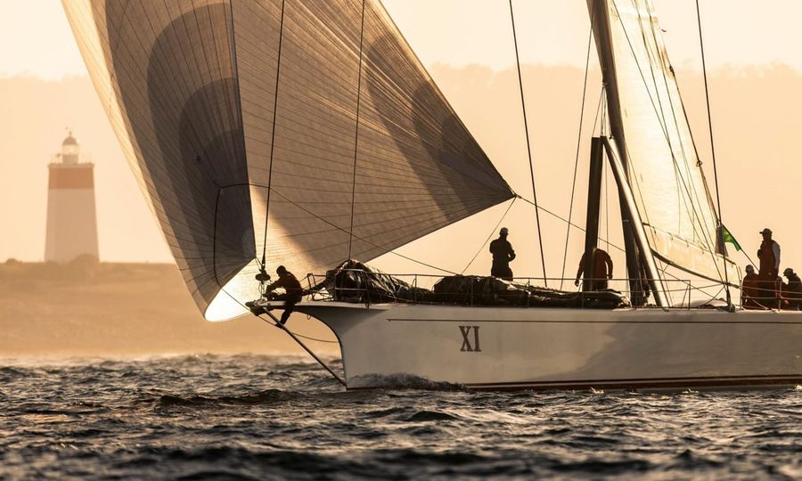 A bowperson hard at work in their element on the water.