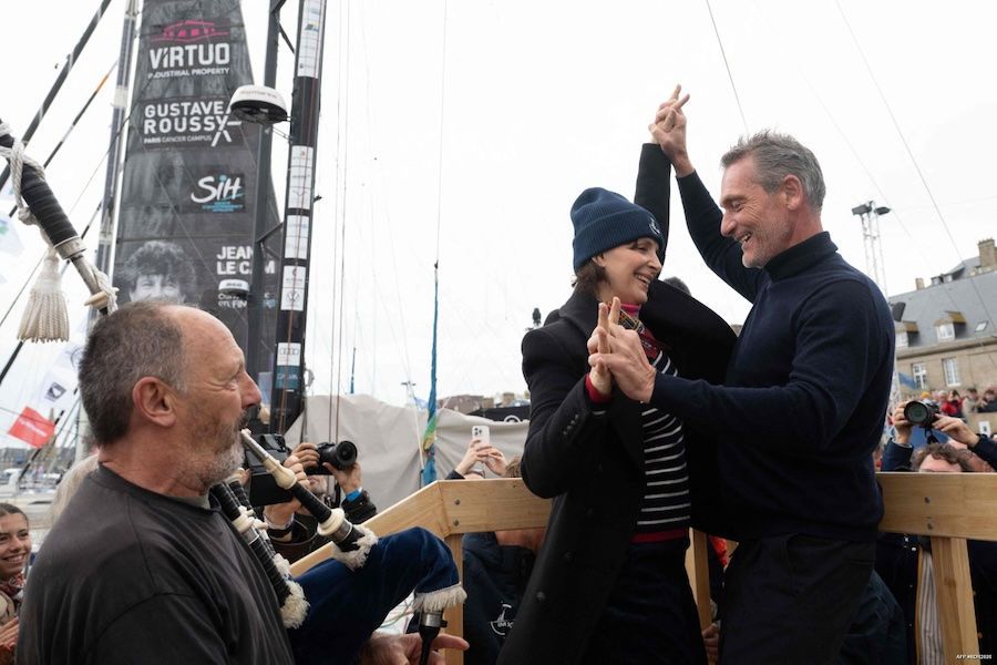Juliette Binoche and Christophe Bachmann at the christening ceremony. Photo: Sébastien Salom-Gomis/AFP