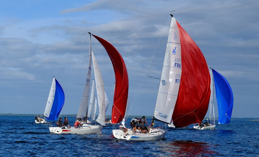 Spinnakers fill as the fleet jostles for position in France