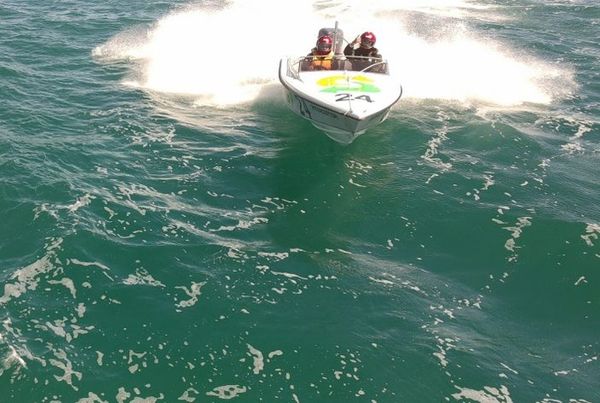A thumbs-up from the Subway crew as boat 24 powers through the Gulf Harbour chop.