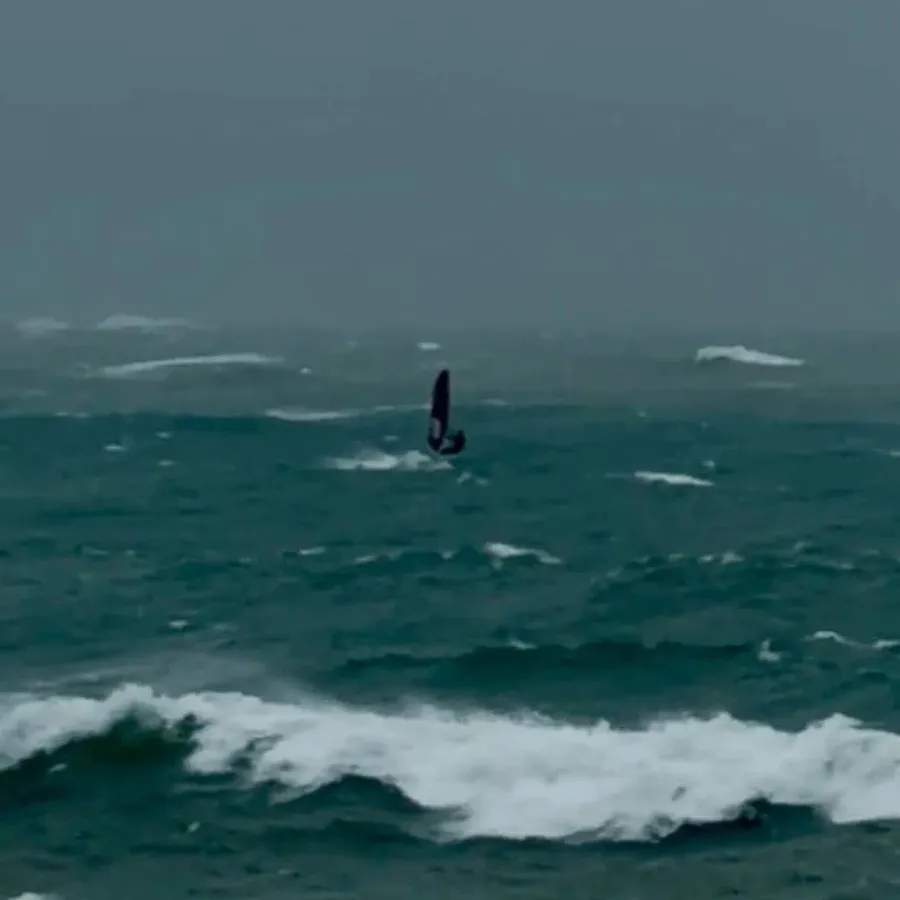 A-man-windsurfing-in-rough-seas-near-Napier-has-been-told-off-by-the-coastguard-for-wasting-precious-resources-during-a-state-of-emergency.-credit-Facebook-.webp