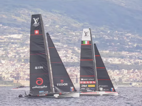 Alinghi and Luna Rossa wait with the rest of the fleet for the start of racing on Day 1 of Naples 2026.