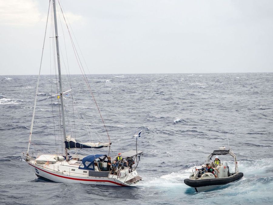 The rescue crew from Australian Defence Force ship, Reliant, mid-rescue attempt