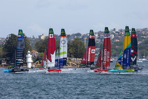 New Zealand SailGP Team helmed by Peter Burling leads the fleet past Shark Island on Race Day 2 of the KPMG Australia Sail Grand Prix in Sydney, Australia. Sunday 9 February 2025. Rolex SailGP Championship Event 3 Season 2025. Photo: Brett Phibbs for SailGP.