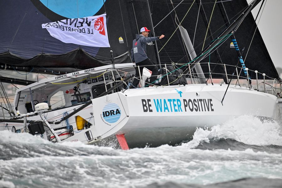 LES SABLES D’OLONNE - JUNE 13, 2024 : Be Water Positive skipper Scott Shawyer (CAN) is pictured celebrating during arrivals of the New York Vendee sailing race, in Les Sables d'Olonne, on June 13, 2024. // Photo by Jean-Louis Carli / Alea.