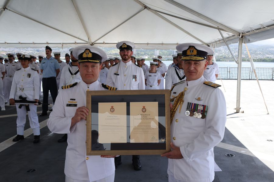 Chief of Navy, Rear Admiral Garin Golding presents Commander Sutherland with his Command Directive