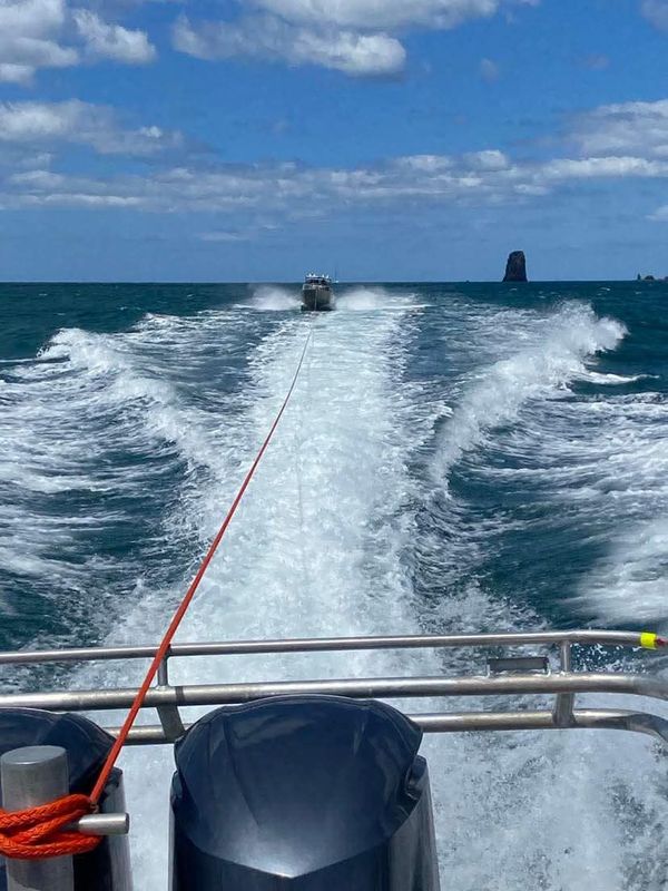 Coastguard Whitianga towing a launch back to the marina / Facebook