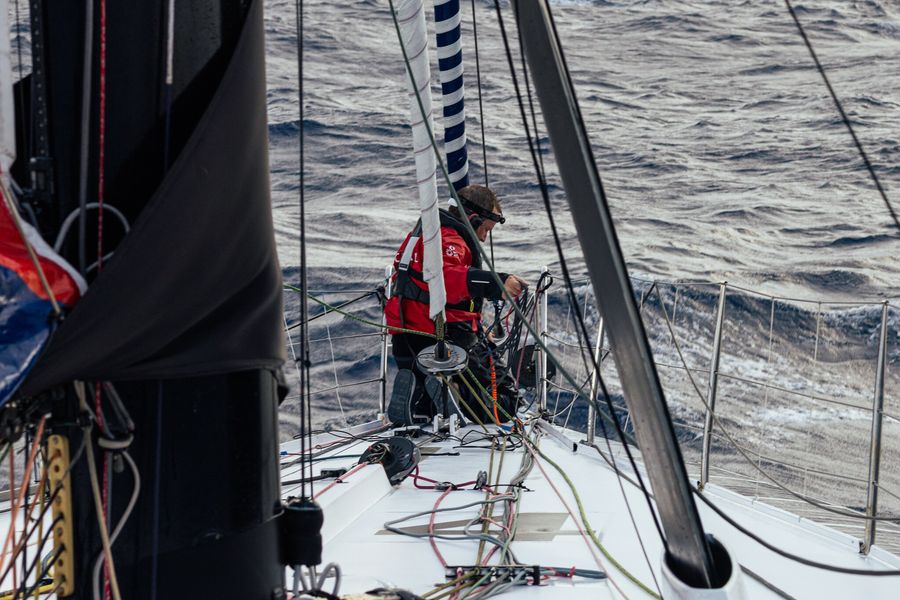 Conrad Colman completing the last repairs on the J2 furler in The Ocean Race Atlantic, on board MSIG Europe