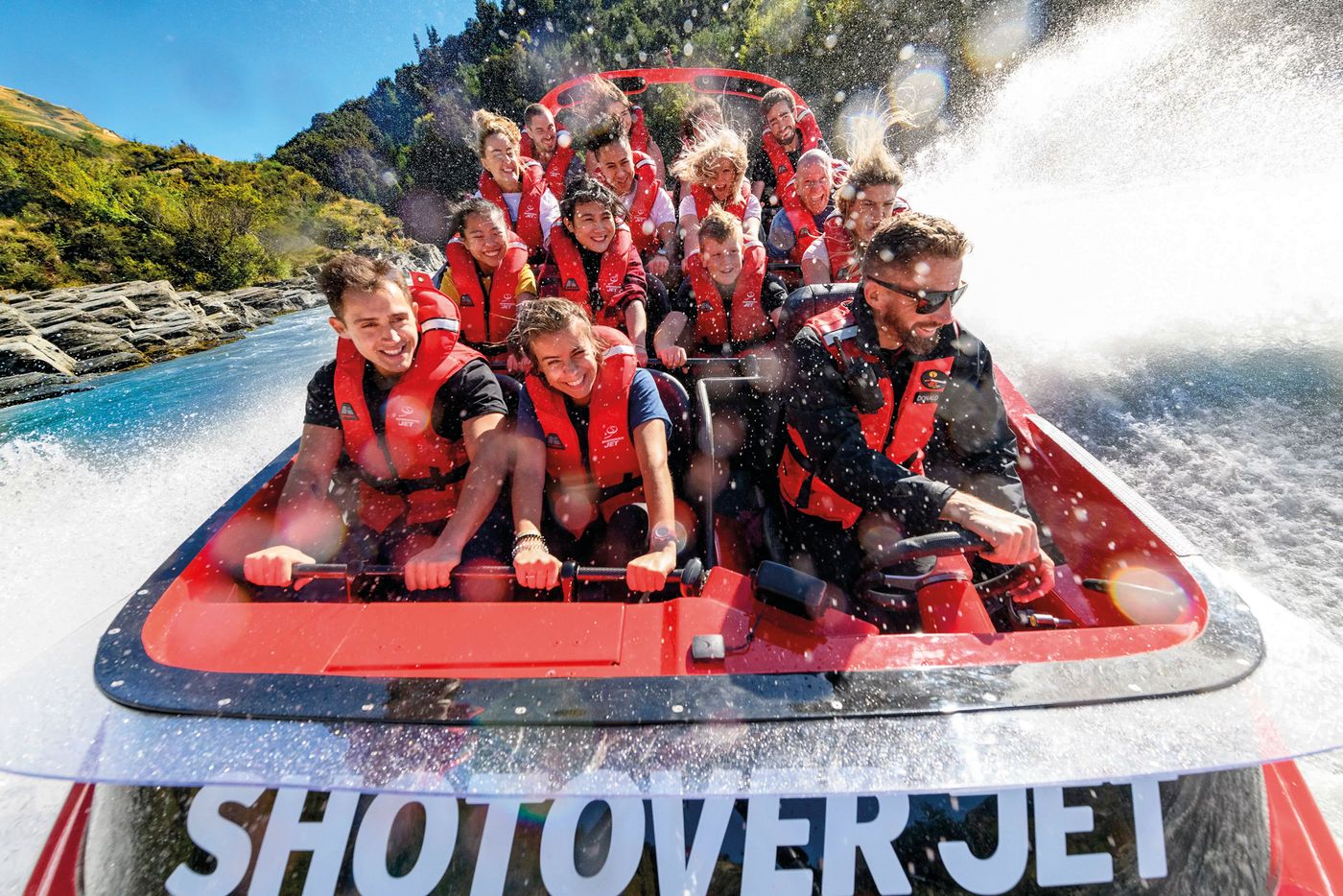 Donald Boyer on the helm with another boat load of Shotover Jet guests