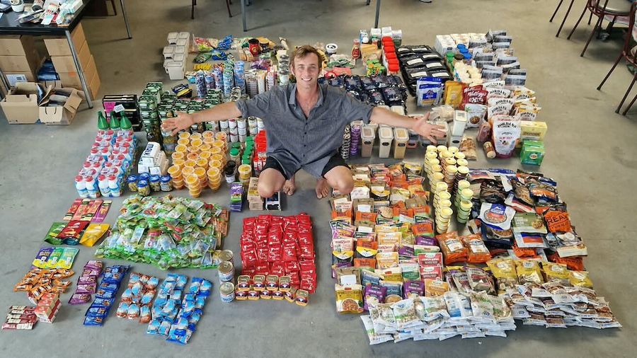 Swiss skipper Étienne Messikommer surrounded by around 250 days' worth of food before it's loaded aboard his Tradewind 35 Bernard, with every meal planned ahead of eight months alone at sea.