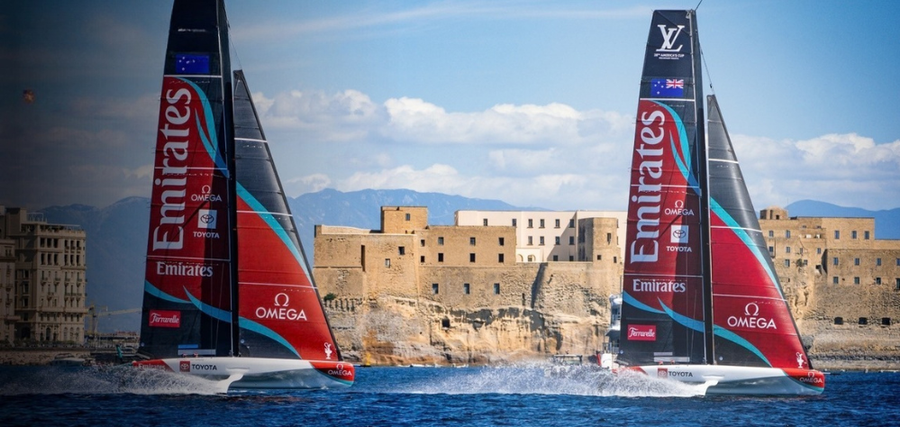 Emirates Team New Zealand’s two AC40s sail past Castel dell’Ovo on the Bay of Naples ahead of the 2026 Preliminary Regatta.