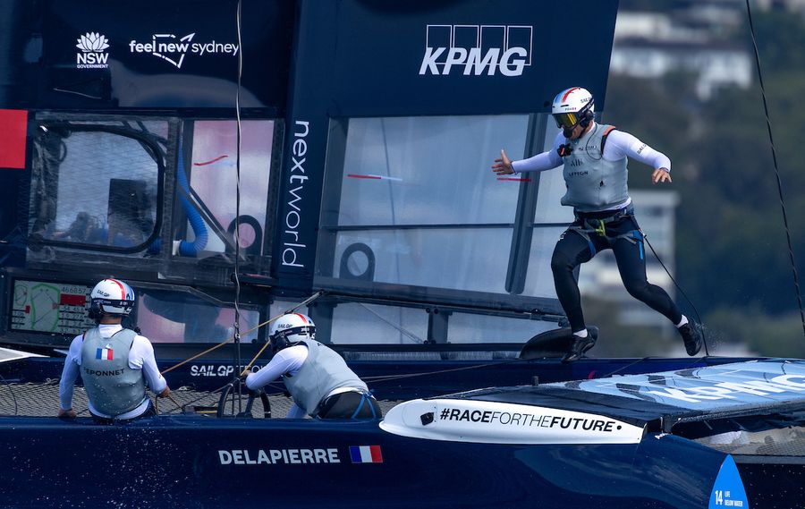 Quentin Delapierre, driver of France SailGP Team runs across the boat to join Manon Audinet, strategist of France SailGP Team, and Kevin Peponnet, wing trimmer of France SailGP Team on Race Day 1 of the KPMG Australia Sail Grand Prix in Sydney, Australia. Saturday 8 February 2025. Rolex SailGP Championship Event 3 Season 2025. Photo credit: Felix Diemer/SailGP media