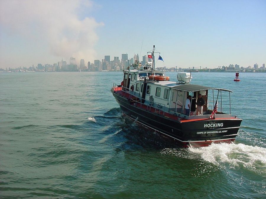By US Army Corps of Engineers from USA - USACE Patrol Boat Hocking heads toward lower Manhattan on 9-11, Public Domain, https://commons.wikimedia.org/wiki/File:WORLD_TRADE_CENTER_ATTACK.jpg