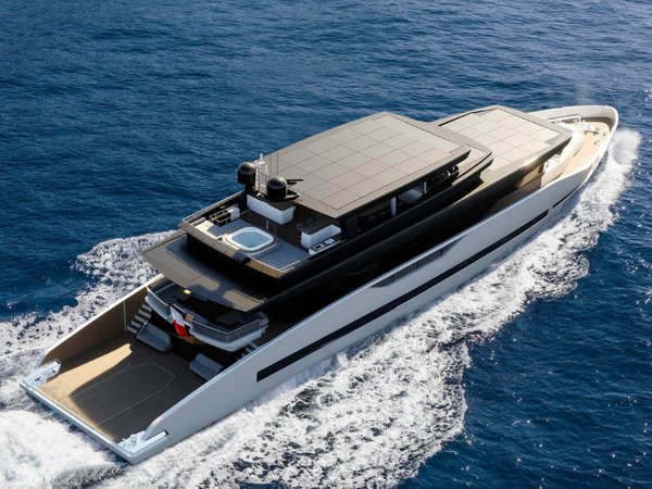 The GX Superyachts GX42 underway, showing its expansive aft deck and large solar-panel array integrated into the upper surfaces.