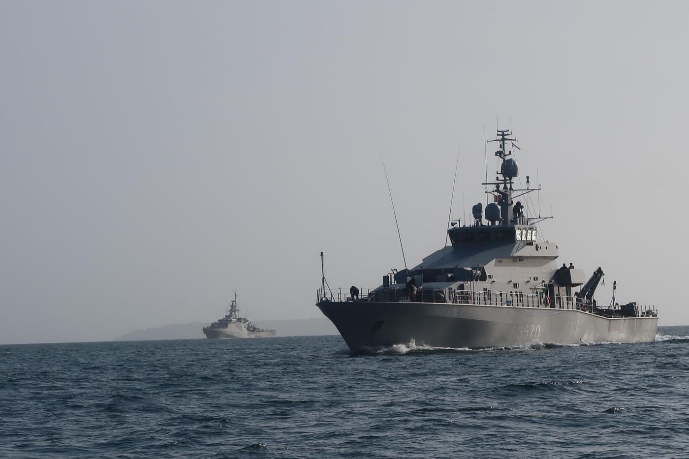 HMNZS Taupo lead HMS Tamar in 2024 into Auckland Harbour