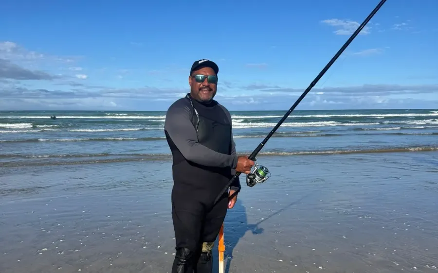 Harley-Ra-takes-a-break-from-fishing-during-the-Ninety-Mile-Beach-Snapper-Bonanza.-Photo-Supplied-.webp