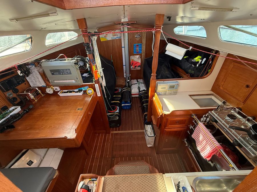 Damien Guillou's Rustler 36 Solarem sits packed and secured, ready for sea, a contrast in preparation styles as the fleet's big challenge looms.