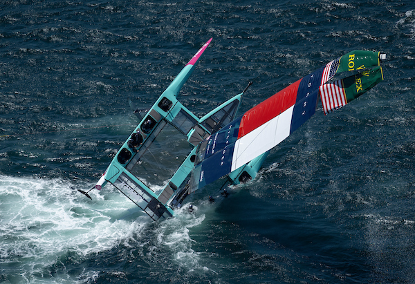 The USA SailGP Team F50 catamaran is recovered by a support crew after it capsized whilst being towed on to the race area for a practice session ahead of the KPMG Australia Sail Grand Prix in Sydney, Australia. Friday 7 February 2025. Rolex SailGP Championship Event 3 Season 2025. Photo: Jon Buckle for SailGP.