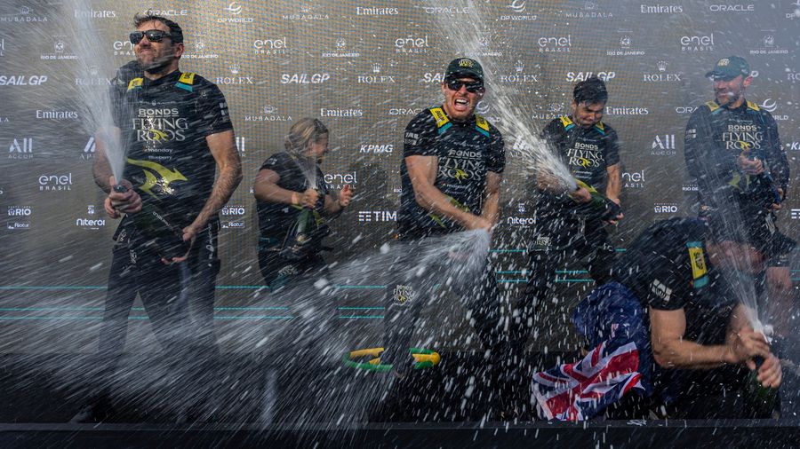 Australia's BONDS Flying Roos spray champagne after claiming the podium in Rio during the 2026 SailGP season.