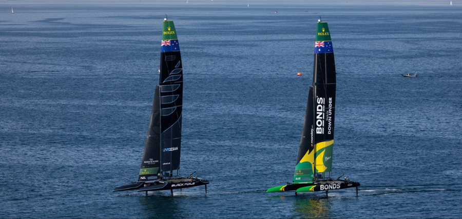 L-R: New Zealand SailGP Team (Black Foils) with BONDS FLying Roos (Australia SailGP Team)