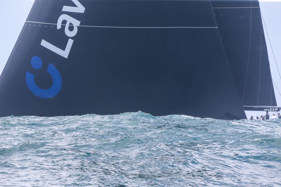 LawConnect just about disappears behind a swell Photo- Rolex Sydney Hobart on Facebook