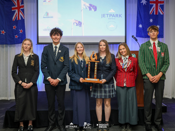 Representatives of New Zealand’s Nations Trophy winning schools, from left: Whangārei Girls’ High School, Auckland Grammar School, Nelson College for Girls, Macleans College, Westlake Girls High School and Westlake Boys High School. The Kiwi teams reclaimed the trophy at the 2026 JetPark Secondary Schools Interdominion Team Racing Championships.