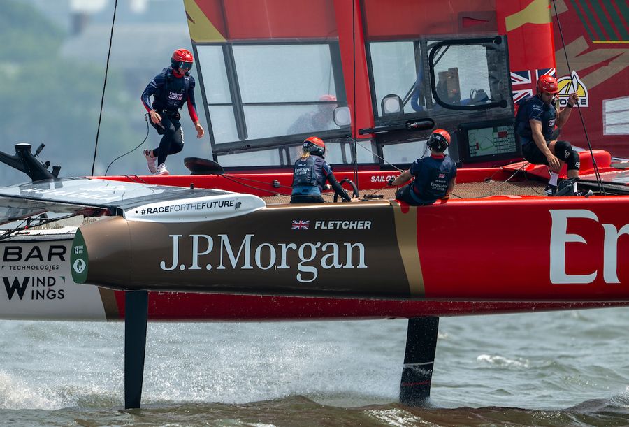 Hannah Mills, strategist of Emirates Great Britain SailGP Team, behind the wheel as Dylan Fletcher, driver of Emirates Great Britain SailGP Team, crosses the Emirates Great Britain SailGP Team F50 catamaran during a practice session ahead of the Mubadala New York Sail Grand Prix in New York, USA. Friday 6 June 2025. Rolex SailGP Championship Event 6 Season 2025. Photo: Ricardo Pinto for SailGP. Handout image supplied by SailGP