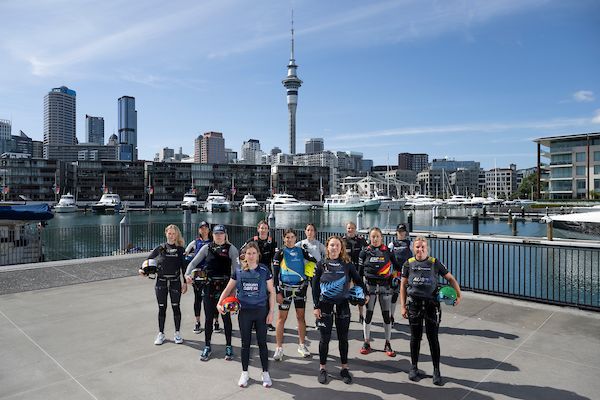 (L-R) Anna Barth, strategist of Germany SailGP Team, Giulia Fava, strategist of Red Bull Italy SailGP Team, Anna Weis, grinder and jib trimmer of USA SailGP Team, Hannah Mills, strategist of Emirates Great Britain SailGP Team, Maud Jayet, strategist of Switzerland SailGP Team, Martine Grael, driver of Mubadala Brazil SailGP Team, Manon Audinet, strategist of France SailGP Team, Liv Mackay, strategist of New Zealand SailGP Team, Anne-Marie Rindom, strategist of ROCKWOOL Denmark SailGP Team, Nicole van der Velden, strategist of Spain SailGP Team, Annie Haegar, strategist of Canada NorthStar SailGP Team and Natasha Bryant, strategist of Australia SailGP Team in front of the city skyline ahead of The Rolex SailGP 2025 Championship ITM New Zealand Sail Grand Prix in Auckland, New Zealand. Thursday 16 January 2025. Photo credit: Ricardo Pinto for SailGP.