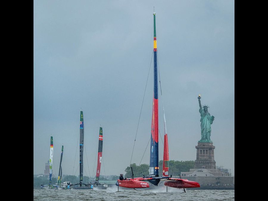 Spain SailGP Team helmed by Diego Botin leads the SailGP Fleet passed the Statue of Liberty during Race 1 on Race Day 1 of the Mubadala New York Sail Grand Prix in New York, USA. Saturday 7 June 2025. Rolex SailGP Championship Event 6 Season 2025. Photo: Ricardo Pinto for SailGP. Handout image supplied by SailGP