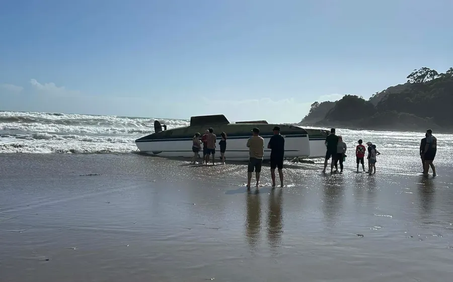 Rescuers-came-to-the-add-of-a-capsized-yacht-on-Sandy-Bay-Beach-in-Northland.-Photo-Supplied-.webp
