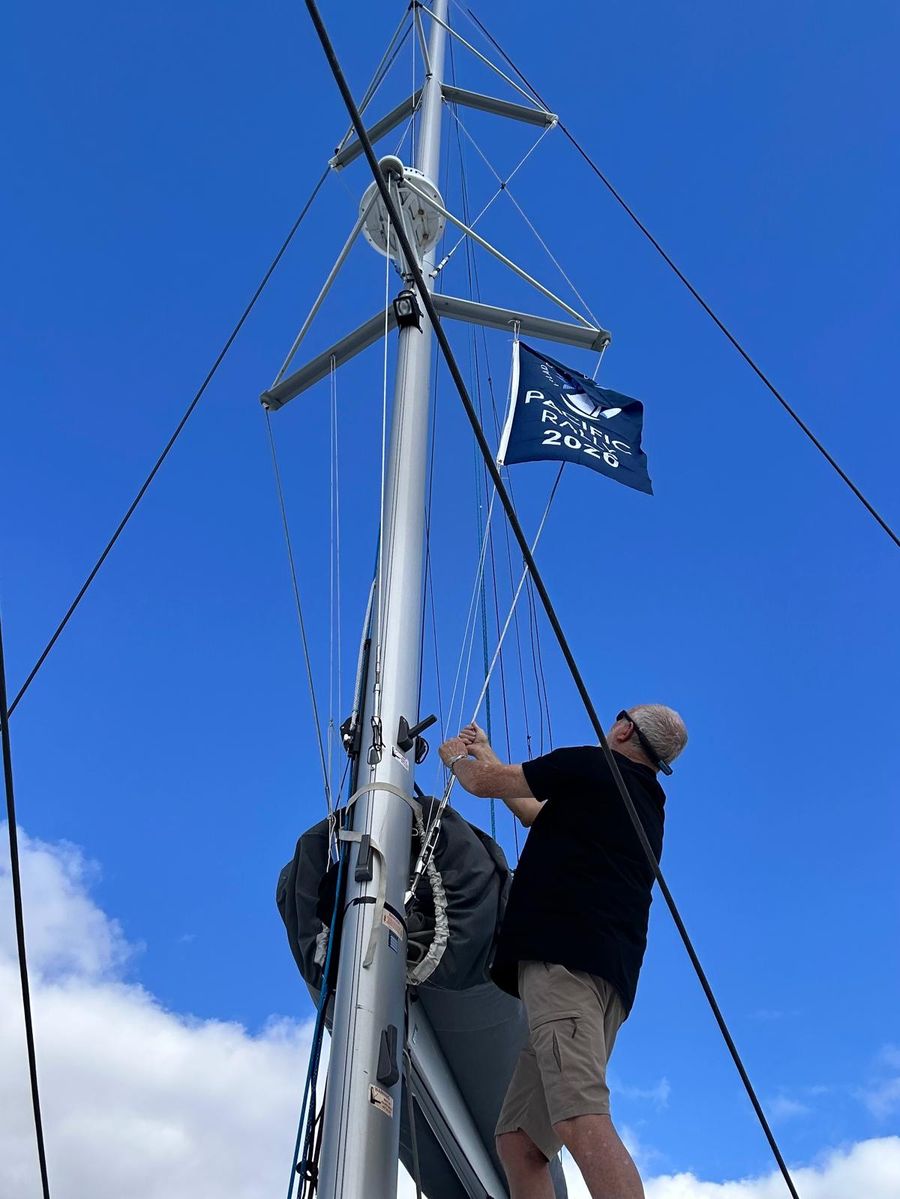 Roger-from-Aroha-raises-the-Pacific-Rally-flag.jpeg