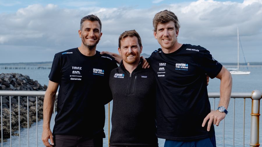 Blair Tuke and Peter Burling with long-distance swimmer Jono Ridler during the 2026 SailGP season.