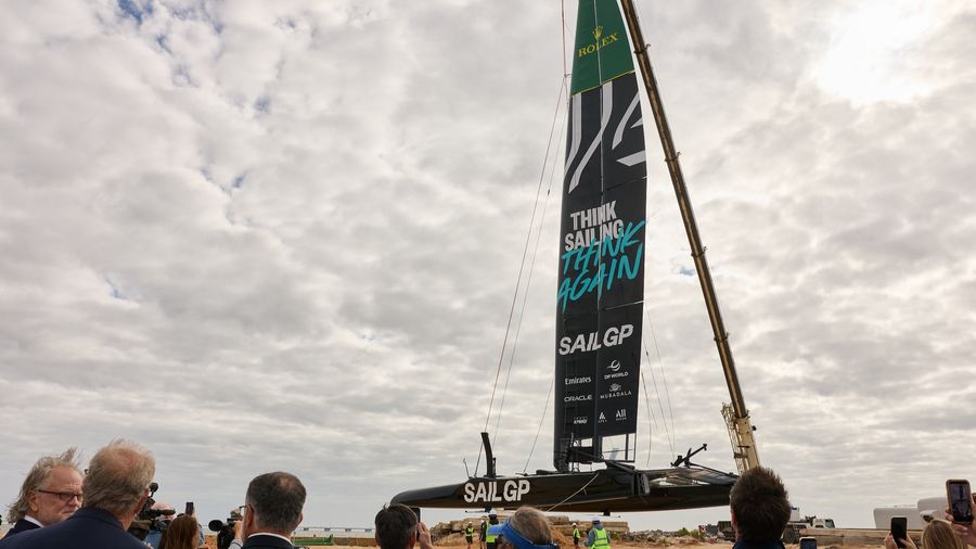 The team's F50 is craned into the water at the new Pensacola base