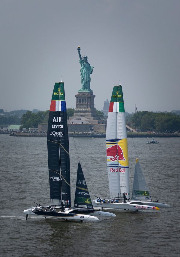 Red Bull Italy SailGP Team, France SailGP Team pass by the Statue of Liberty during a practice session ahead of the Mubadala New York Sail Grand Prix in New York, USA. Friday 6 June 2025. Rolex SailGP Championship Event 6 Season 2025. Photo: Simon Bruty for SailGP. Handout image supplied by SailGP