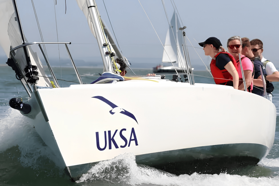 Participants get out on the water in a UKSA J/80 during a Try-a-Boat session.