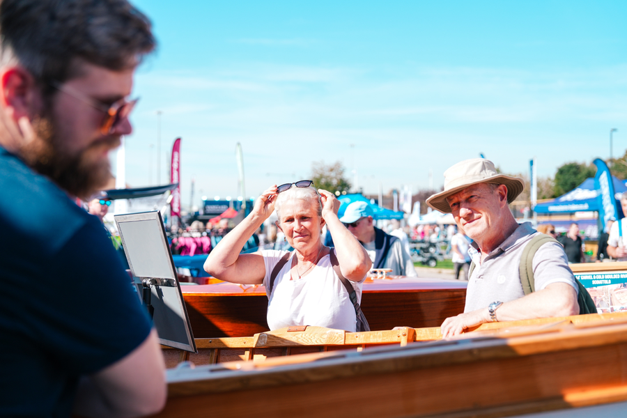 A couple checks out one of the boats on display at the Southampton show.