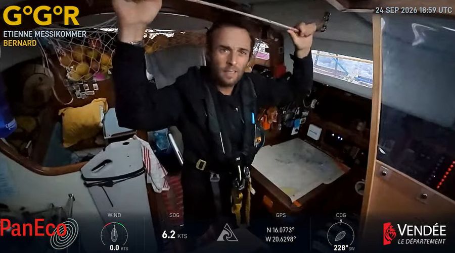 Swiss skipper Etienne Messikommer steadies himself below deck aboard BERNARD in this GGR Window LIVE image from 24 September, still in his sailing gear and harness as conditions worsen. Credit: GGR2026