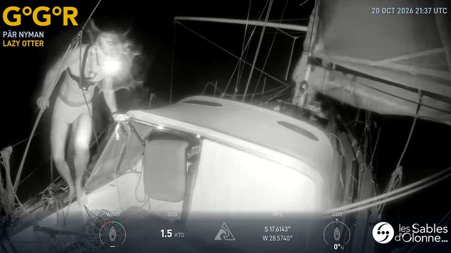 Pär Nyman on deck aboard Lazy Otter in the dark of the South Atlantic, captured by the GGR Window LIVE night-vision camera on 20 October 2026 as the fleet braces for a severe storm.