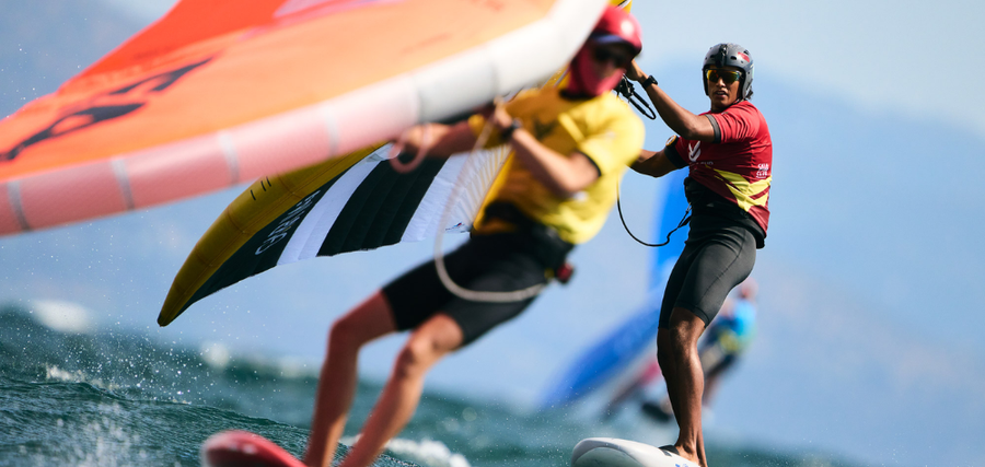 Sean Herbert (NZL) wearing the leader’s Yellow bib chased by Alessandro Tomasi (ITA).