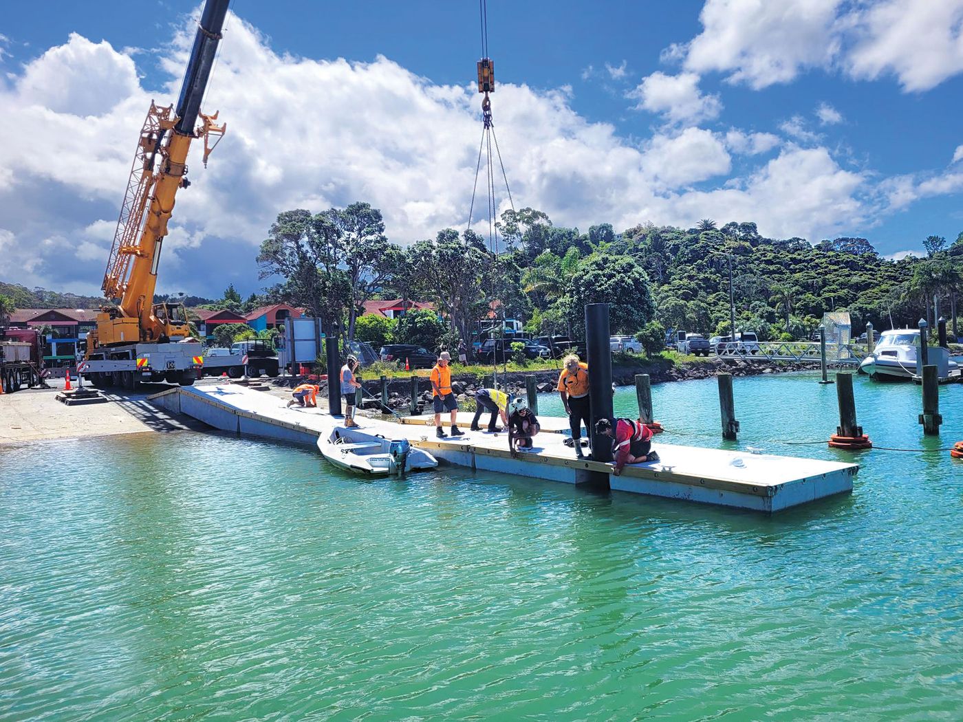 Team-members-from-Robinson-Asphalts-Atlas-Cranes-Johnson-Bros-and-Heron-Construction-work-on-the-reinstated-pontoon.-Photo-credit-Whangarei-District-Council.jpg