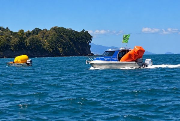 The work continues after racing, with race and support boats bringing the course buoys ashore.