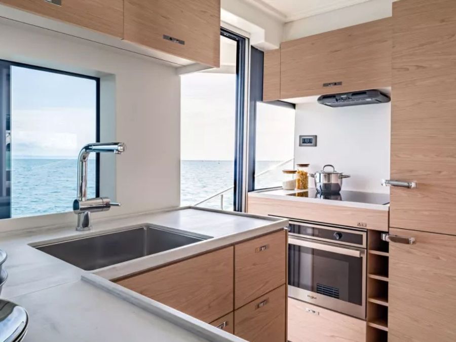 The-Grand-Trawler-63-galley.-Light-tones-in-a-well-appointed-kitchen.-Photo-credit-Beneteau.jpg