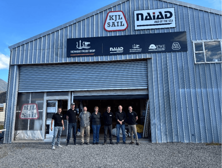 L-R: KJL Sail and Naiad team members Paul Nouvellon, Design Manager, Simon Houghton,<br />Principal Naval Architect, Mike Clark, Naiad Colar Finishing Technician, Josee Derden, KJL Collar<br />Manufacturing Manager, Ian Barclay, Naiad Collar Product and Production Manager, Bill<br />Richards, KJL Textile Fabricator, Andrew Hogg, General Manager Naiad outside the<br />manufacturing facilities of KJL Sails in Picton, New Zealand.